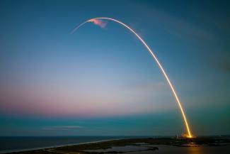 ray of light near body of water by SpaceX courtesy of Unsplash.