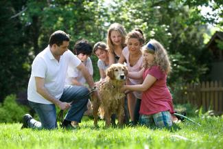 group of people standing on green grass field during daytime by CDC courtesy of Unsplash.