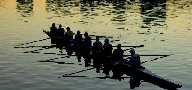 men rowing boat by Mitchell Luo courtesy of Unsplash.